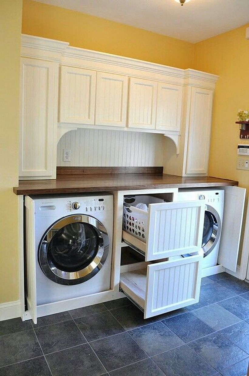 Washing machine with white cabinet storage and drawer