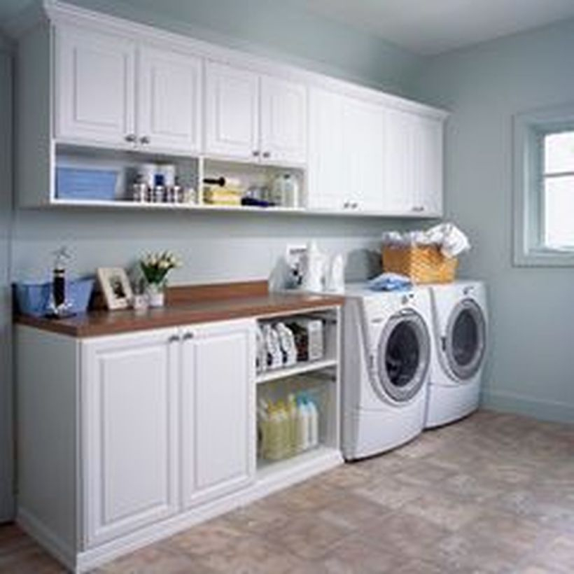 Washing machine with white cabinet storage and rattan storage