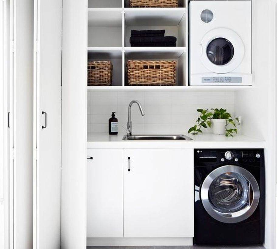 White and black washing machine and rattan storage