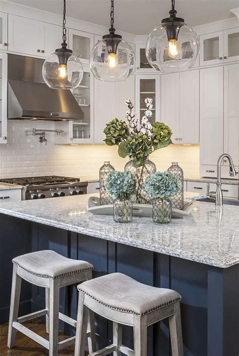 White countertop design with square white wooden chairs
