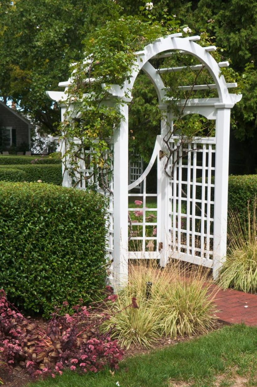 White curved wooden trellis for the gate