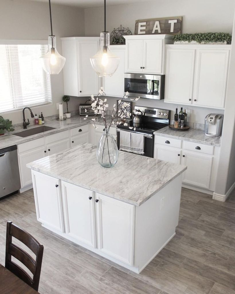 White marble countertop design on white cabinet