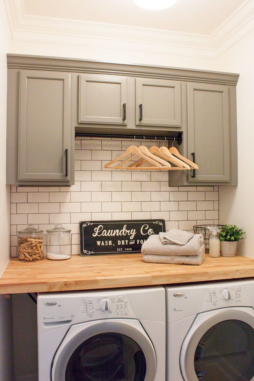 White washing machine and wooden cabinet storage