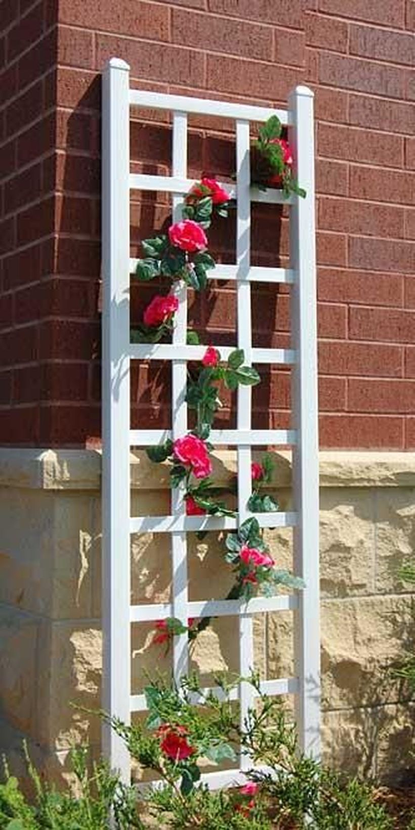 White wooden trellis leaning against the wall