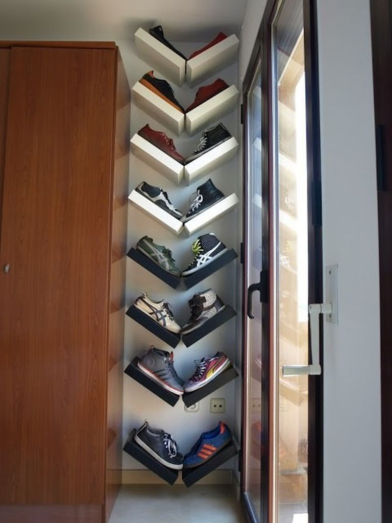 A creative shoes storage for a small bedroom with shelves hanged in a v-shape to perfect your shoes storage