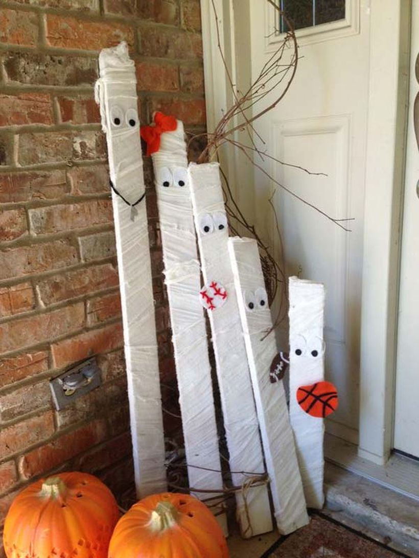 A halloween decoration made from recycled white wood and pumpkin decoration for your patio decor