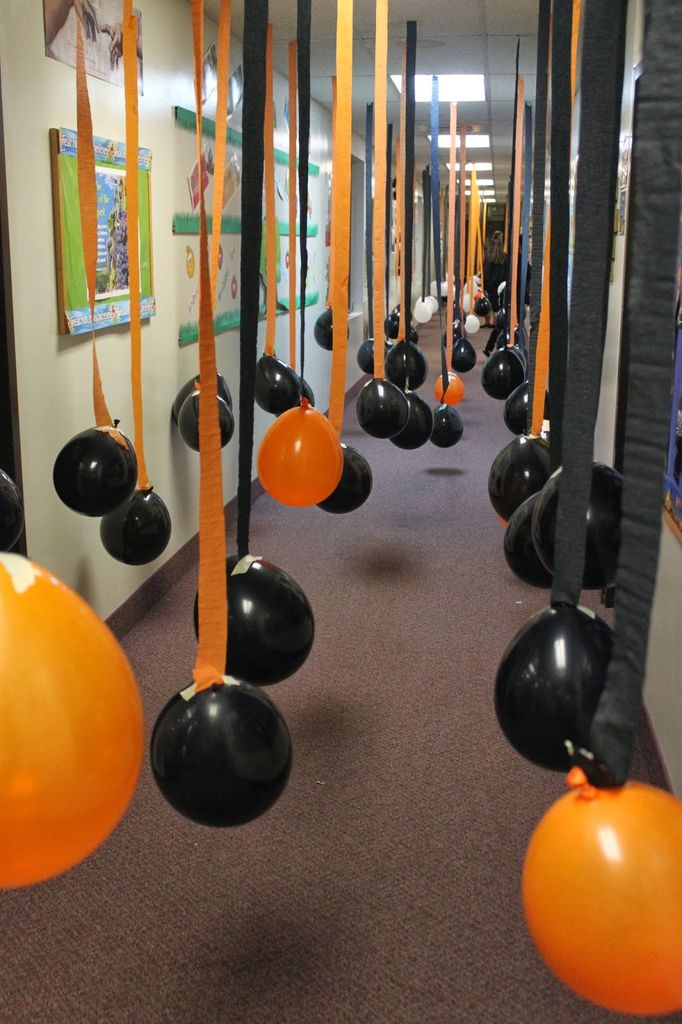 An awesome indoor decorations for halloween with hanging balloons from the ceiling to perfect your decoration