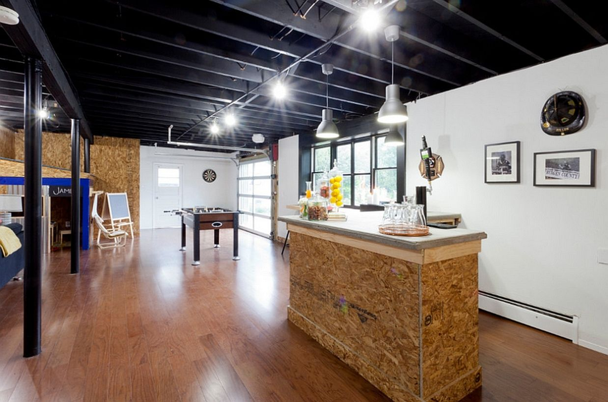 Basement bar with a foosball table and relaxed hangout