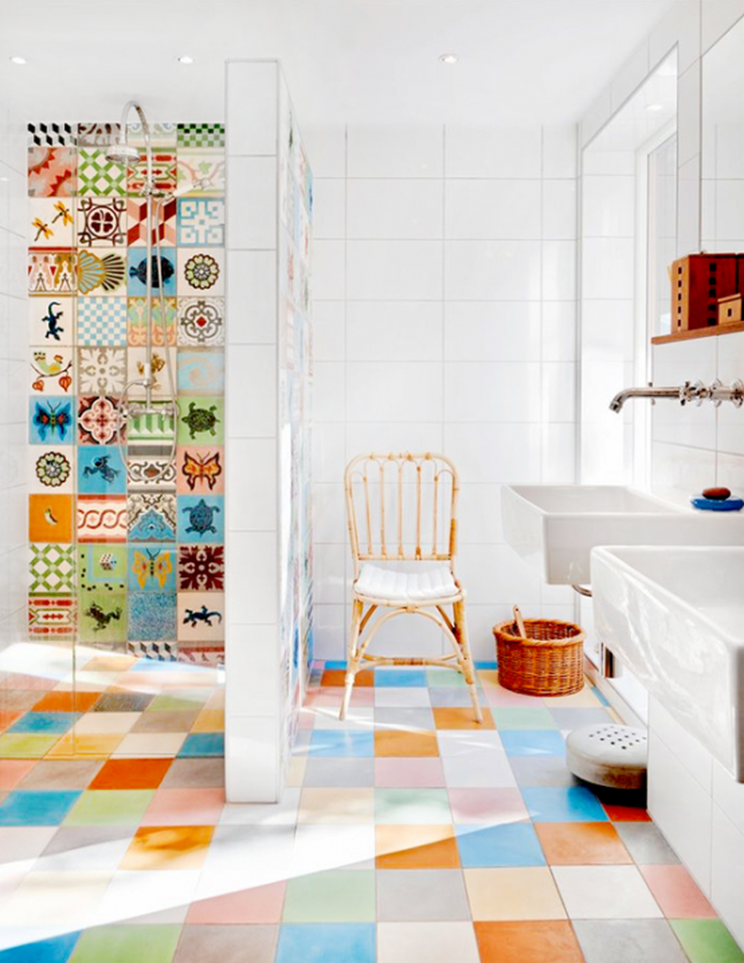 Beautiful bathroom with square colorful tile, rattan chair, and white sink to look awesome