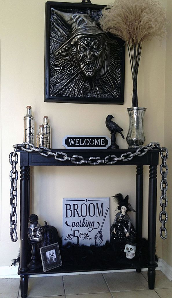 Captivating creepy indoor decorations with wall decoration above black table to perfect your halloween decoration