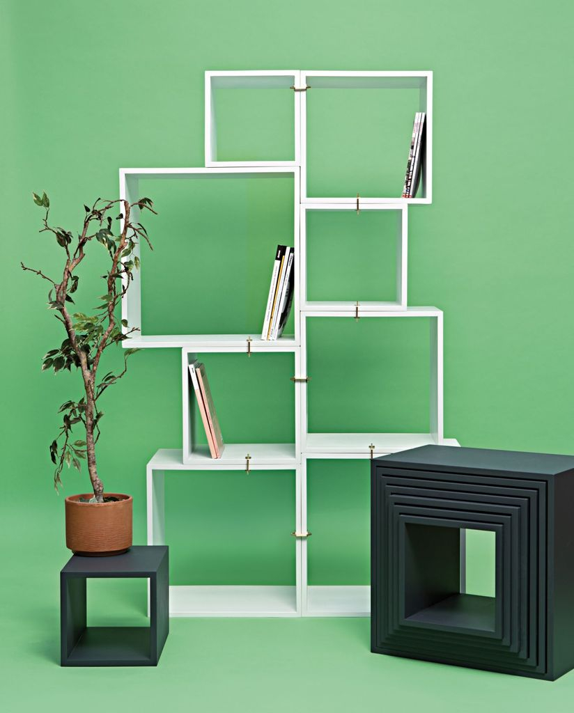 Contemporary book storage ideas for a small bedroom with cube storage in white to organize your book in the small bedroom