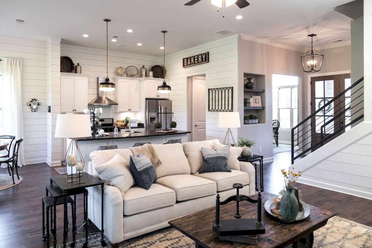 Cozy living room with unique hangig lamps, white sofa and wooden table for amazing decoration