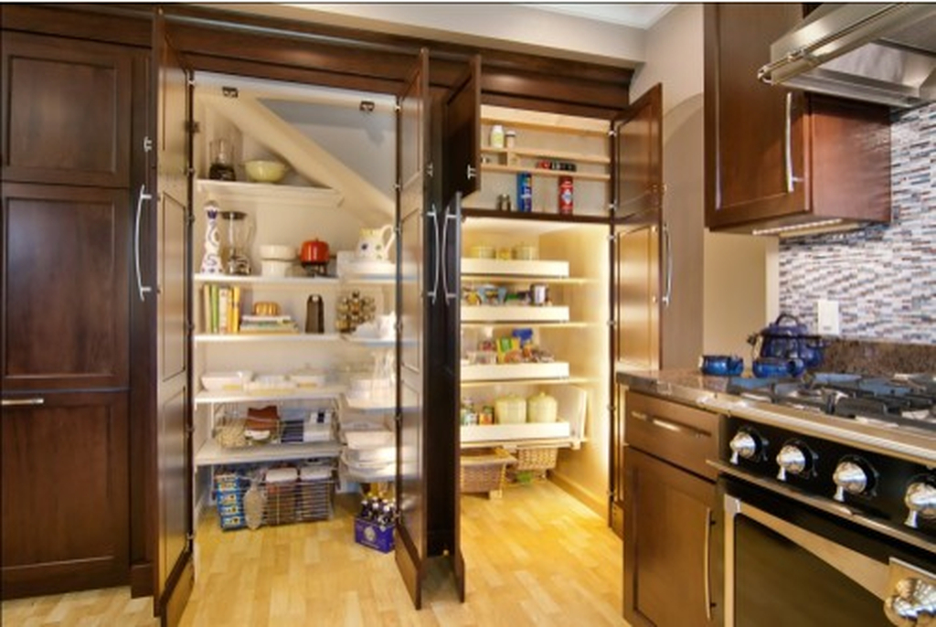 Modern kitchen pantry with white shelves