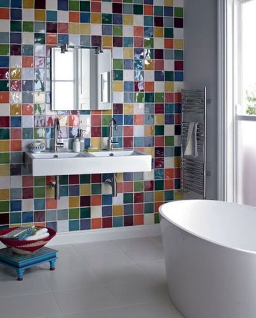 Small bedroom with colorful wall, white sink and white bathup for intresting decoration