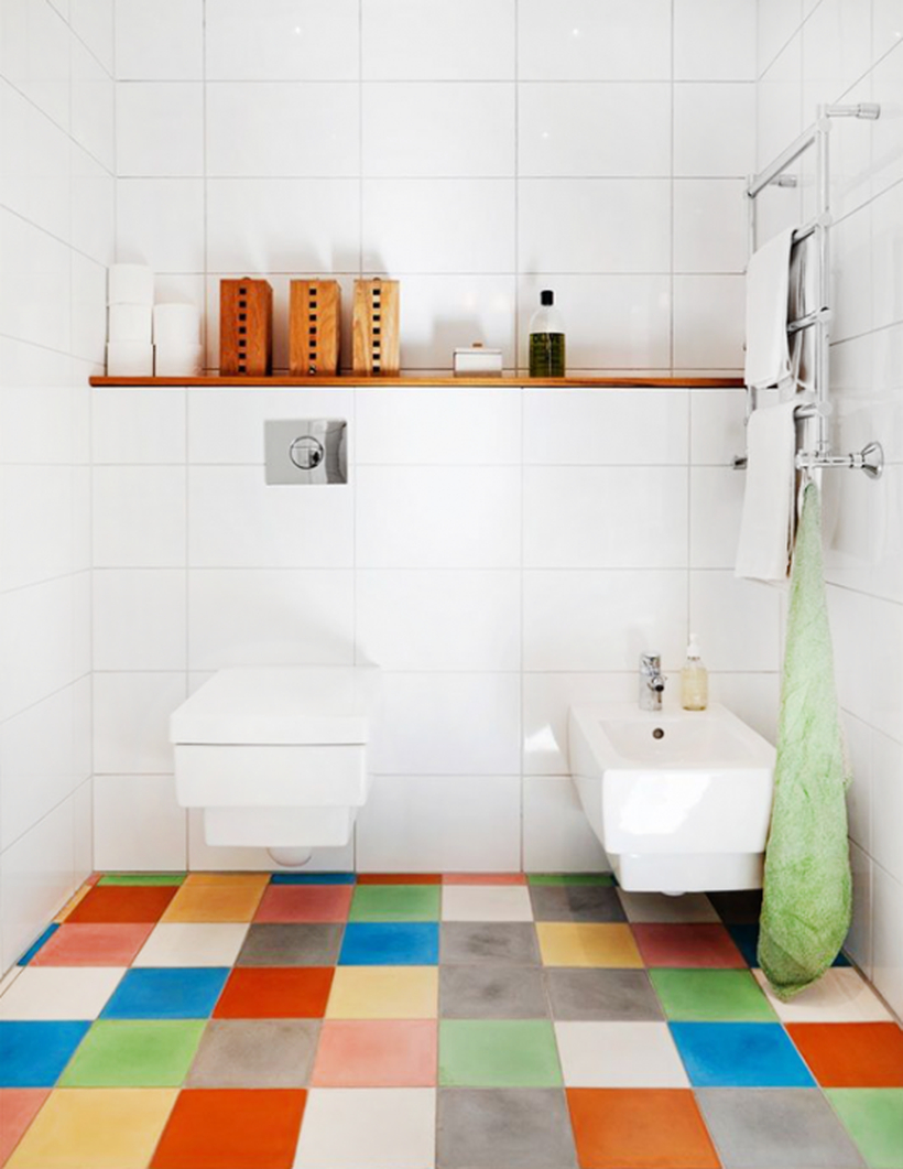 Stunning bathroom with colorful tile, white closet and sink for simple decoration