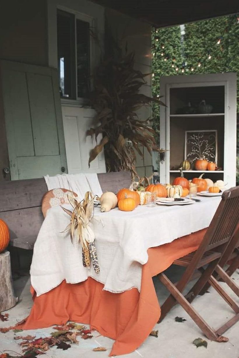 Thanksgiving-decoration-with-pumpkin-and-table-cloth.-