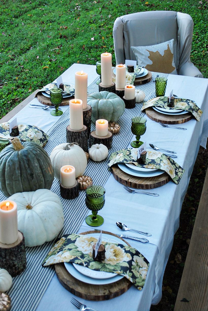 White-tablecloth-white-pumpkin-and-dark-green-for-thanksgiving-dinner.-