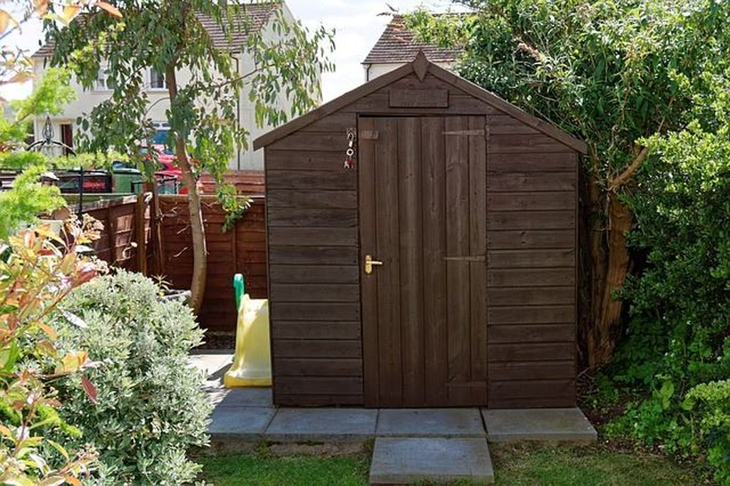 Wooden shed on beside toy