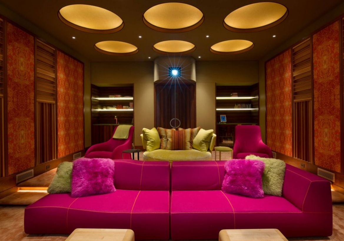 Basement move room with pink sofa and modern lighting