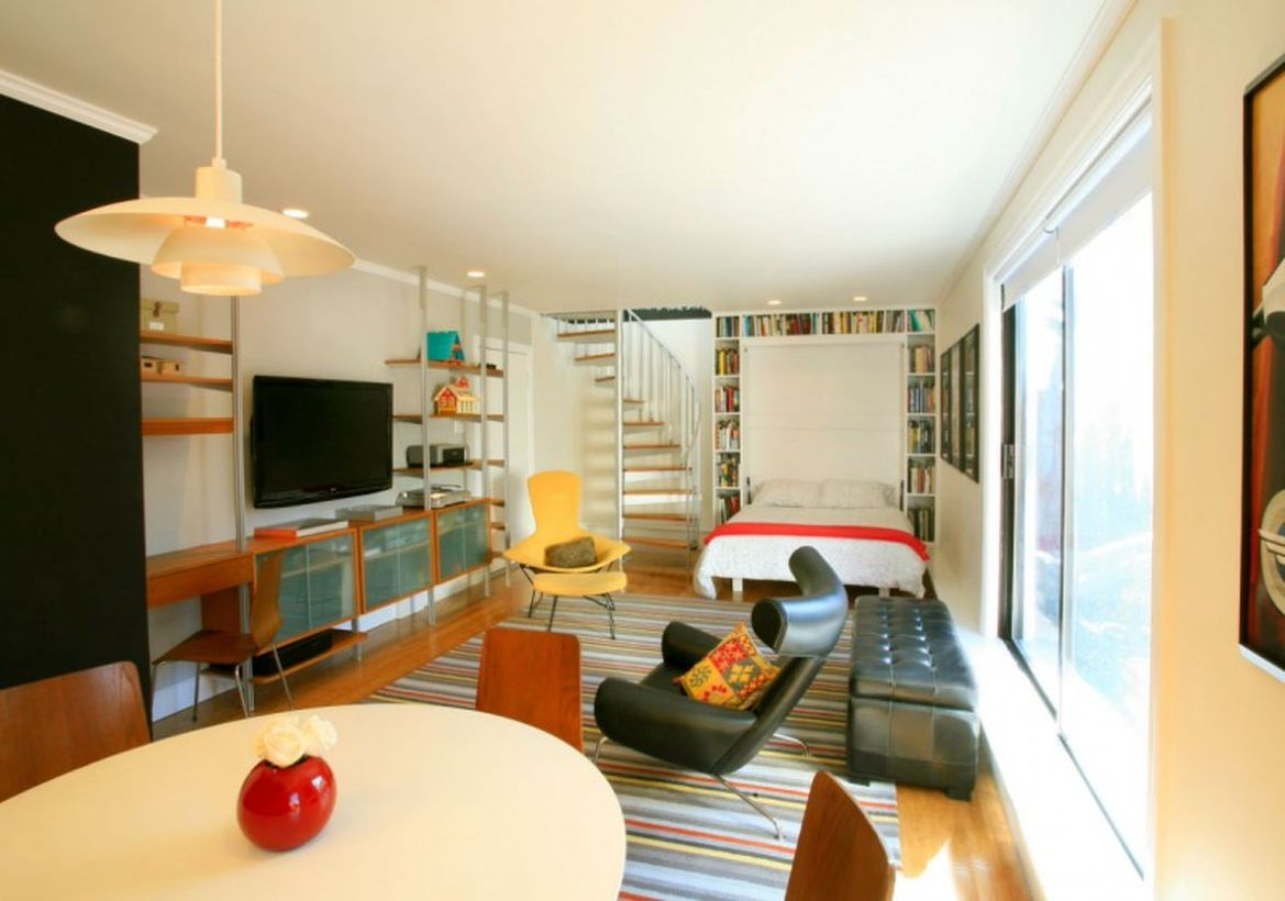 Basement white bedroom, black soffa and round table