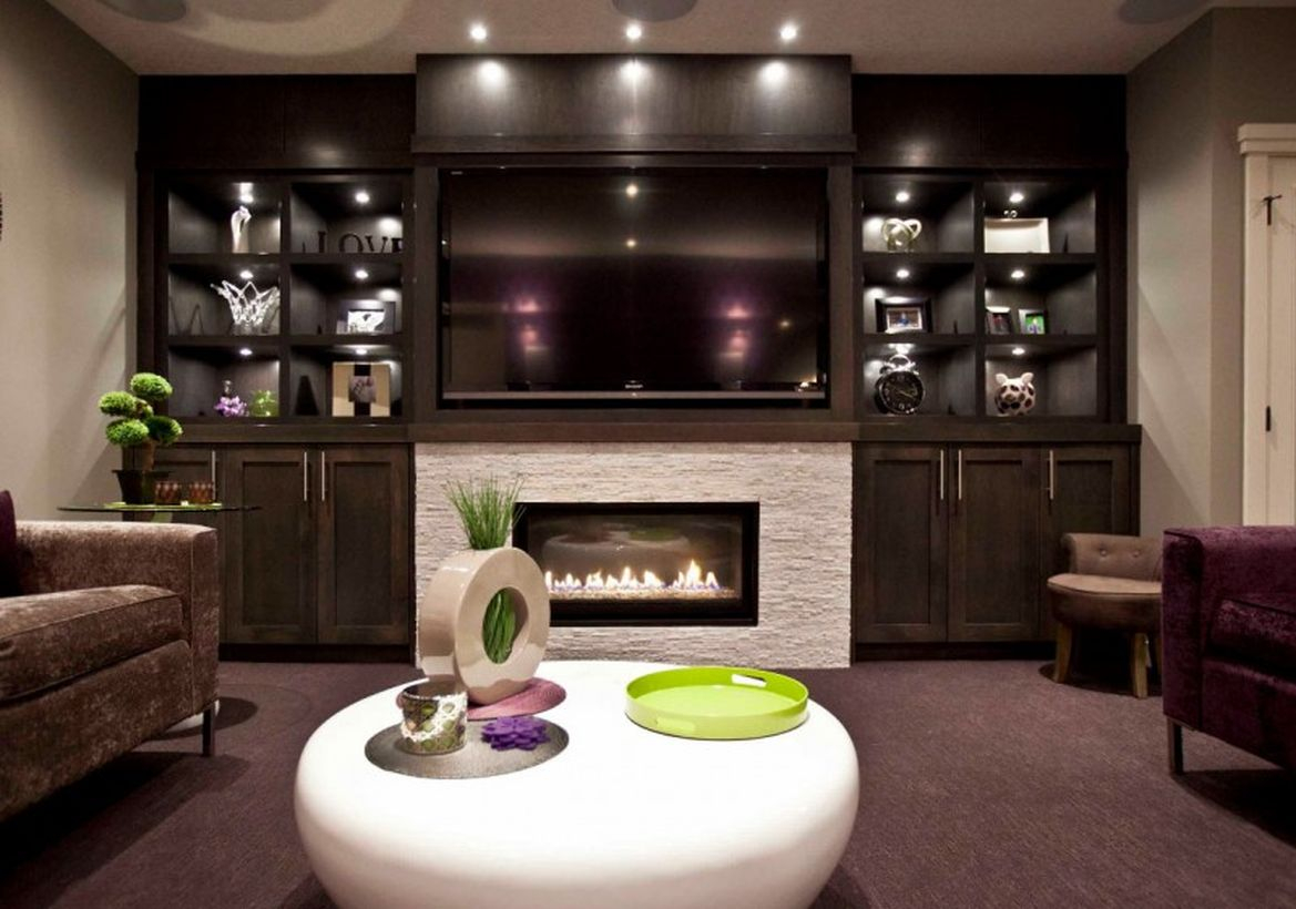 Basement with a living room combined with a white fireplace