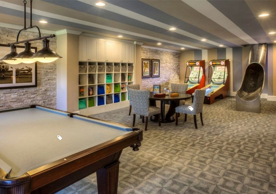 Basement with billiards and gaming areas