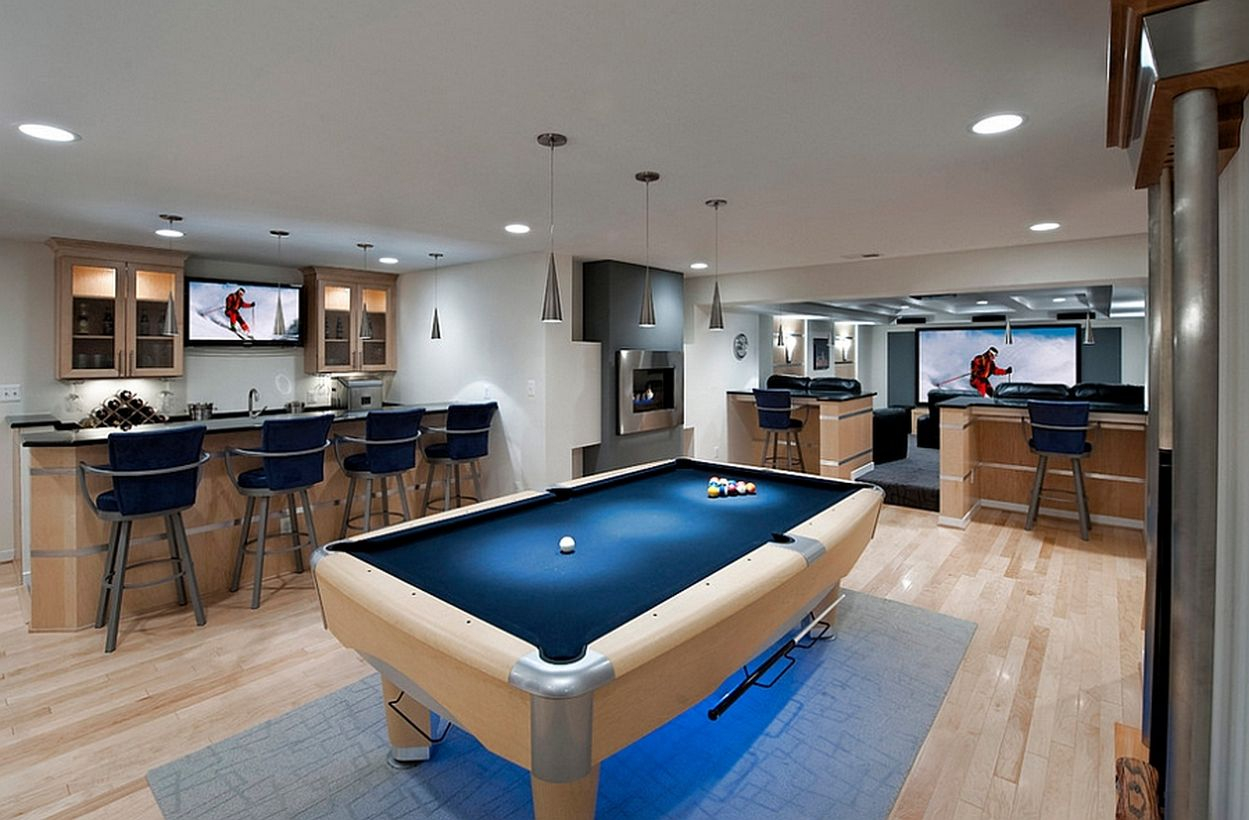 Basement with blue billiard place and modern bar