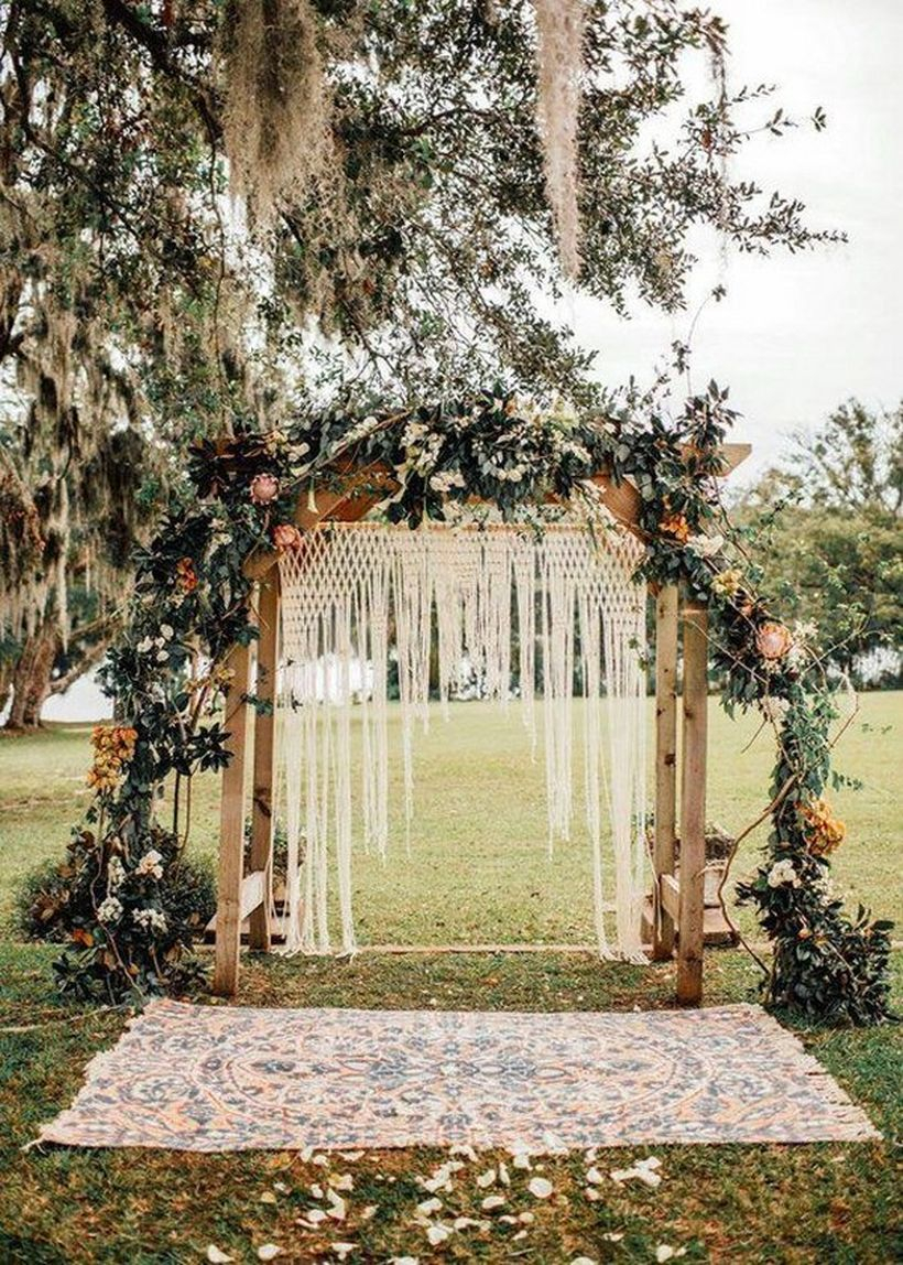 Boho wedding decorations with white knit fabric, flower decoration and green plants