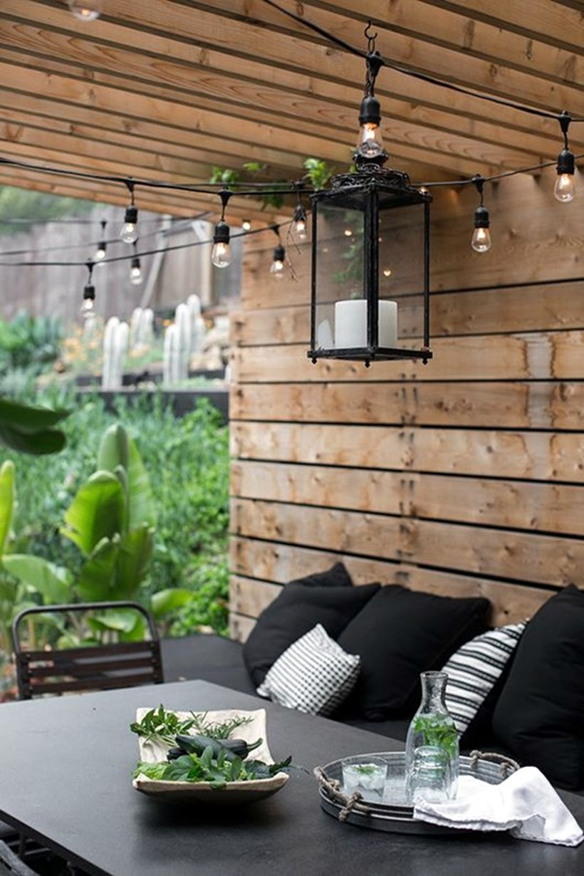 Hanging black lantern and string lamps