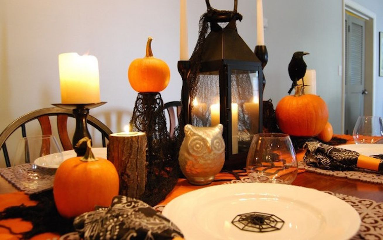 Lantern candle holder and arrangement pumpkins for dinner setting