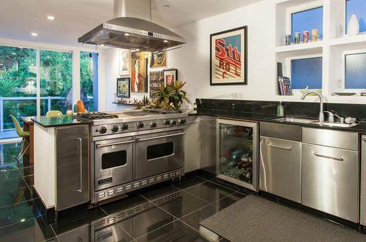 Modern black kitchen flooring with modern cabinet and white walls to look amazing