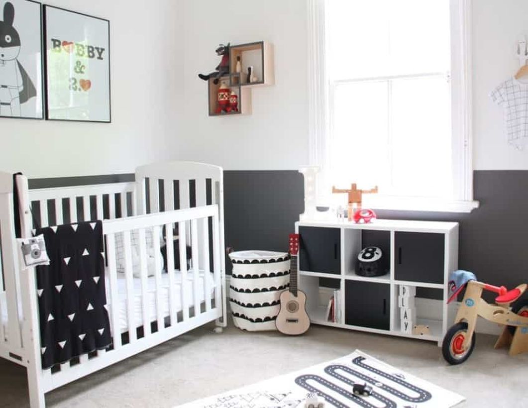 Monochrome-baby-boys-nursery-room-with-white-wooden-bed-baby-and-wooden-storage-to-store-various-ornaments
