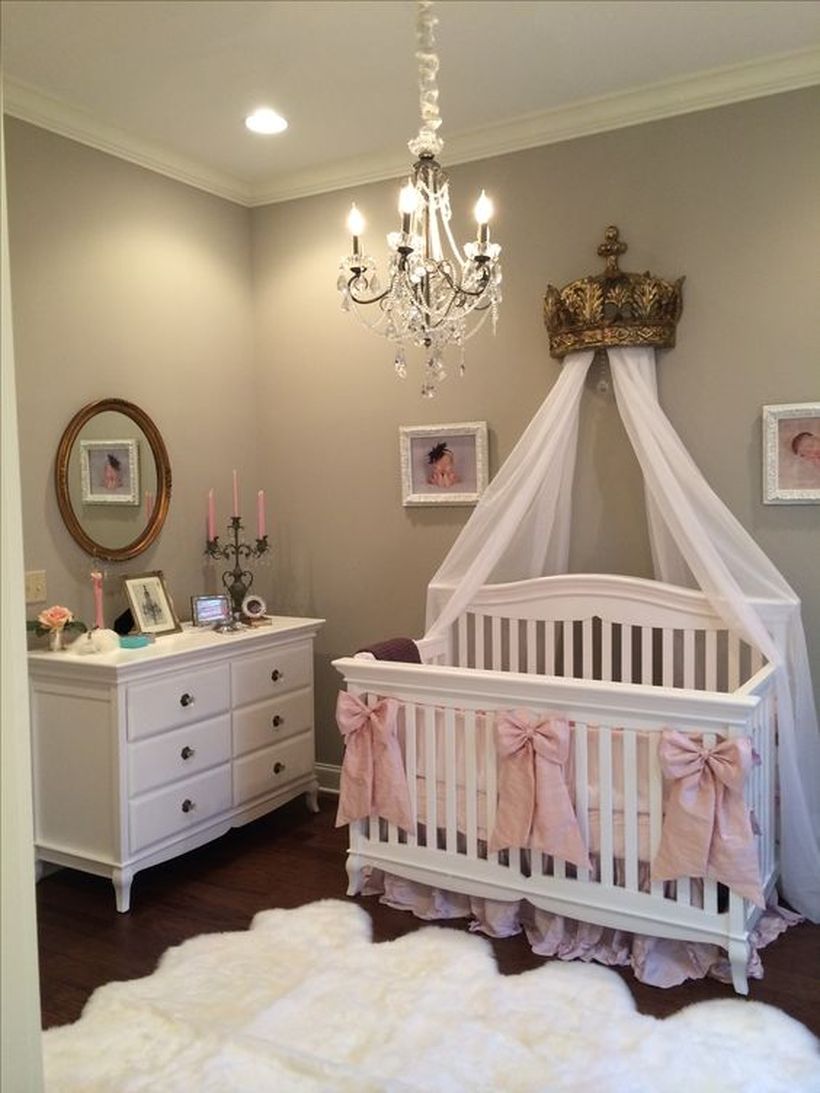 Queen-baby-girls-nursery-room-with-crown-accent-white-drappie-and-wooden-white-bed-for-your-baby