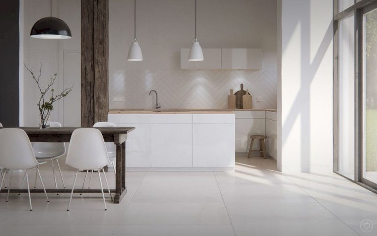 Scandinavian white kitchen flooring combine with white cabinet, square wooden table, white chairs and hanging white lamps