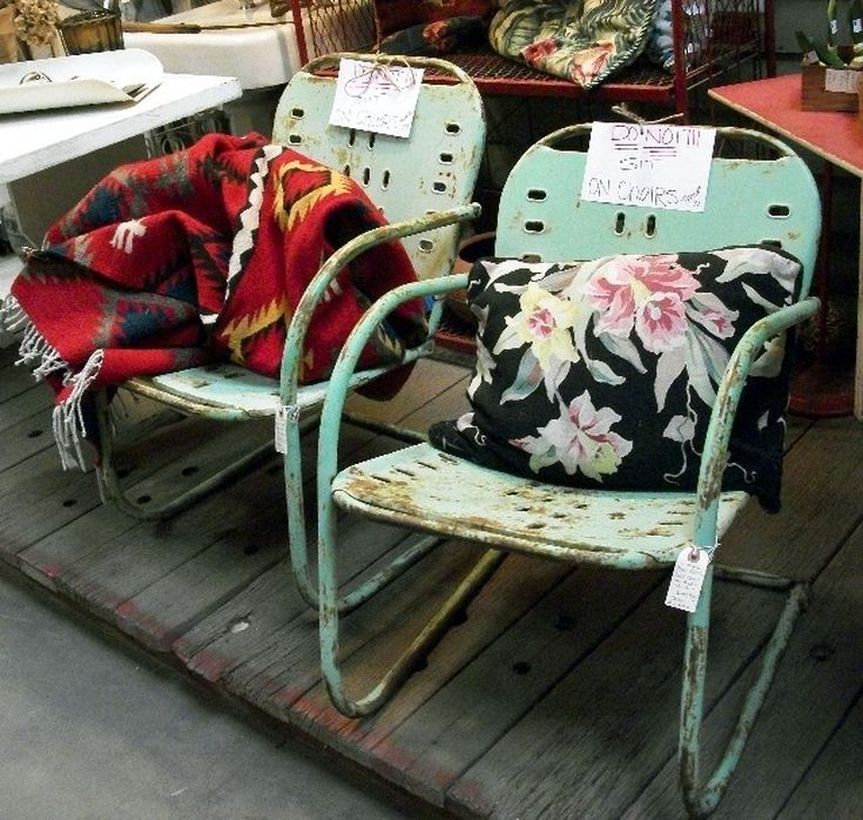 Vintage-outdoor-furniture-with-rusty-old-metal-chairs-and-sofa-cushions-added-for-you-comfort