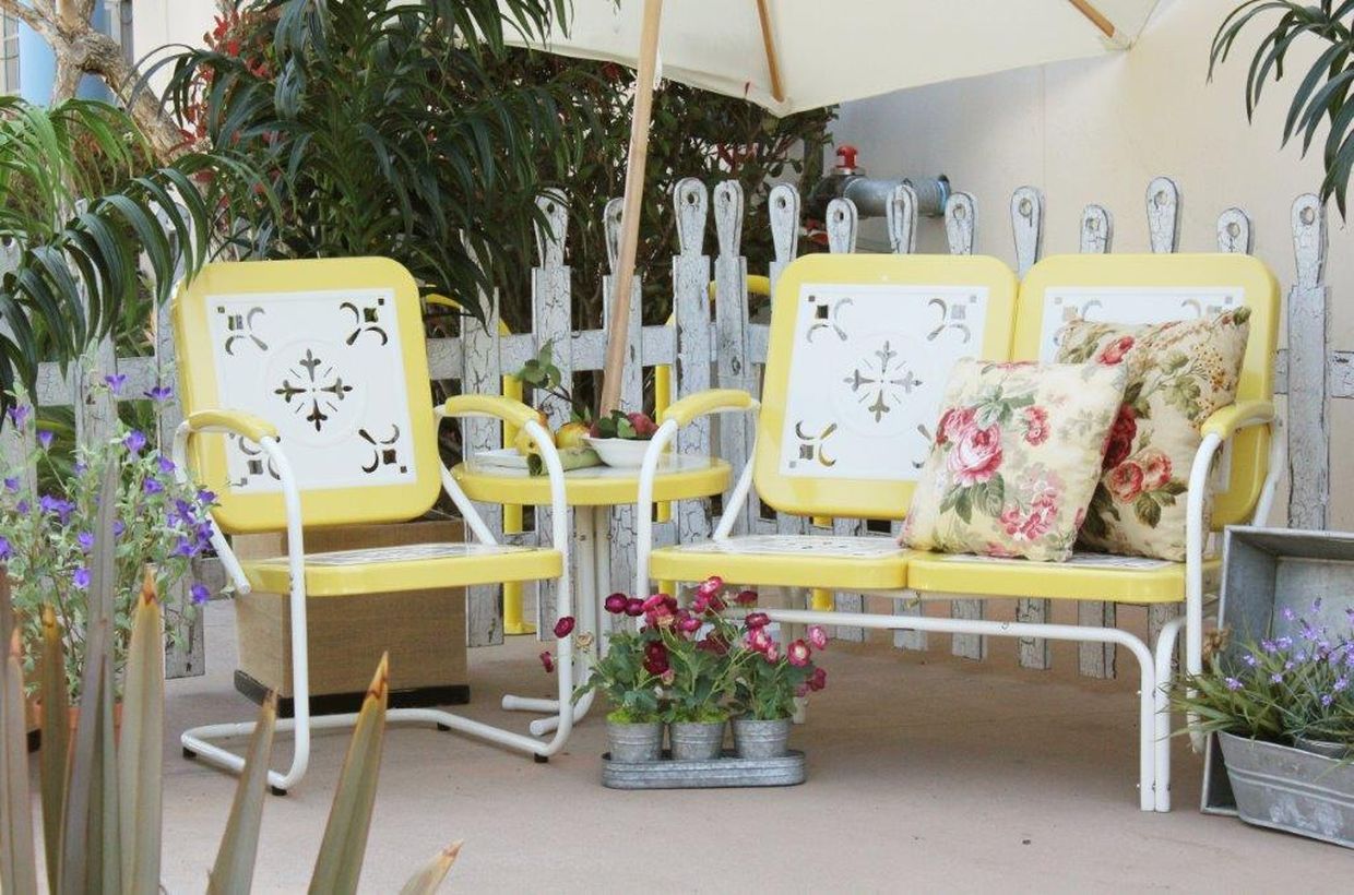 Vintage-outdoor-furniture-with-white-and-yellow-iron-chair-for-relaxing-in-backyard