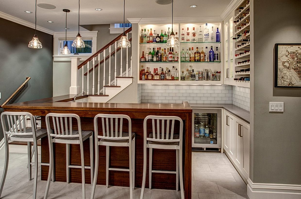 White basement with white bar, white walls, white chairs and wooden table