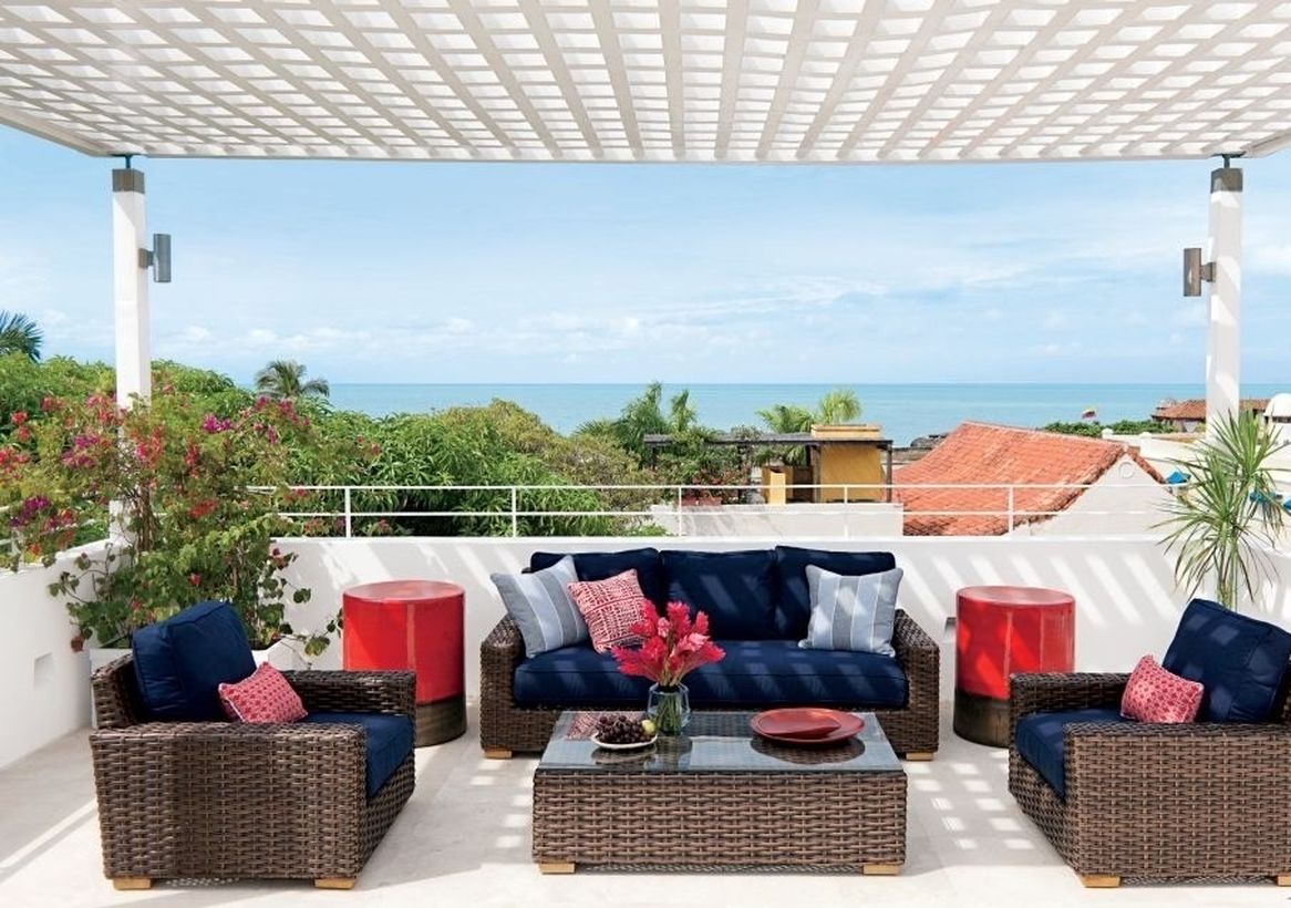 A-shaded-rooftop-with-dark-rattan-chairs-and-soft-foam-to-make-it-more-comfortable-when-sitting
