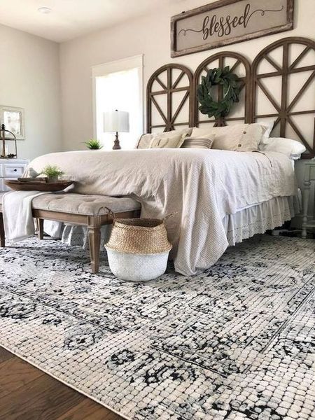 A-catchy-wooden-headboard-a-vintage-bench-and-baskets.-1