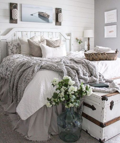A-whitewashed-bed-and-walls-plus-a-chest-and-cozy-textiles.-1