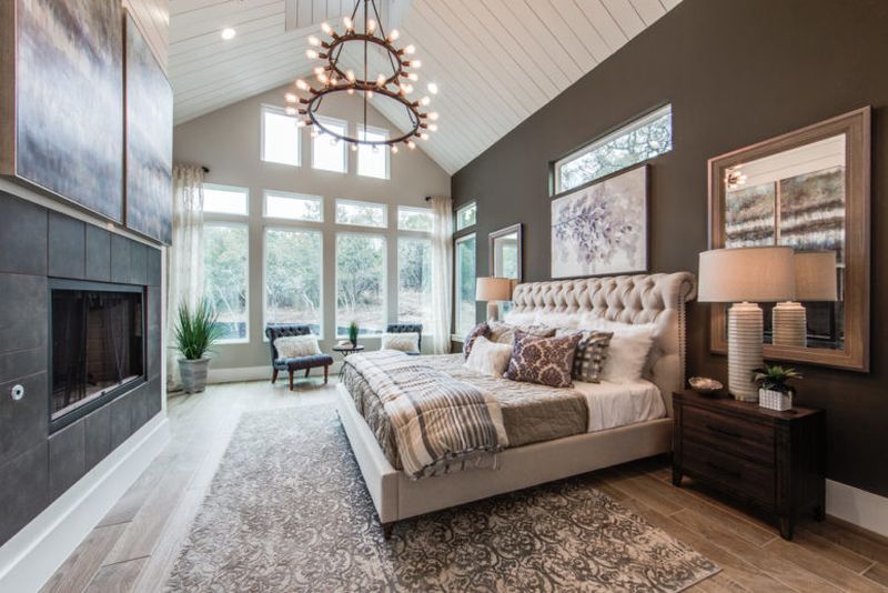 An-attic-white-ceiling-dark-walls-and-a-dark-clad-fireplace-.-1