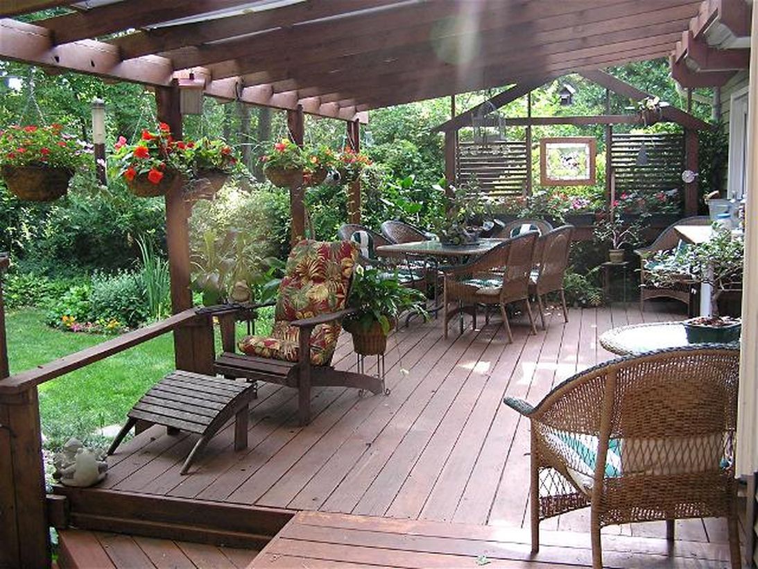 Backyard-patio-deck-design-with-a-greenery-arrangement-to-make-it-look-more-beautiful-and-provide-a-cool-environment