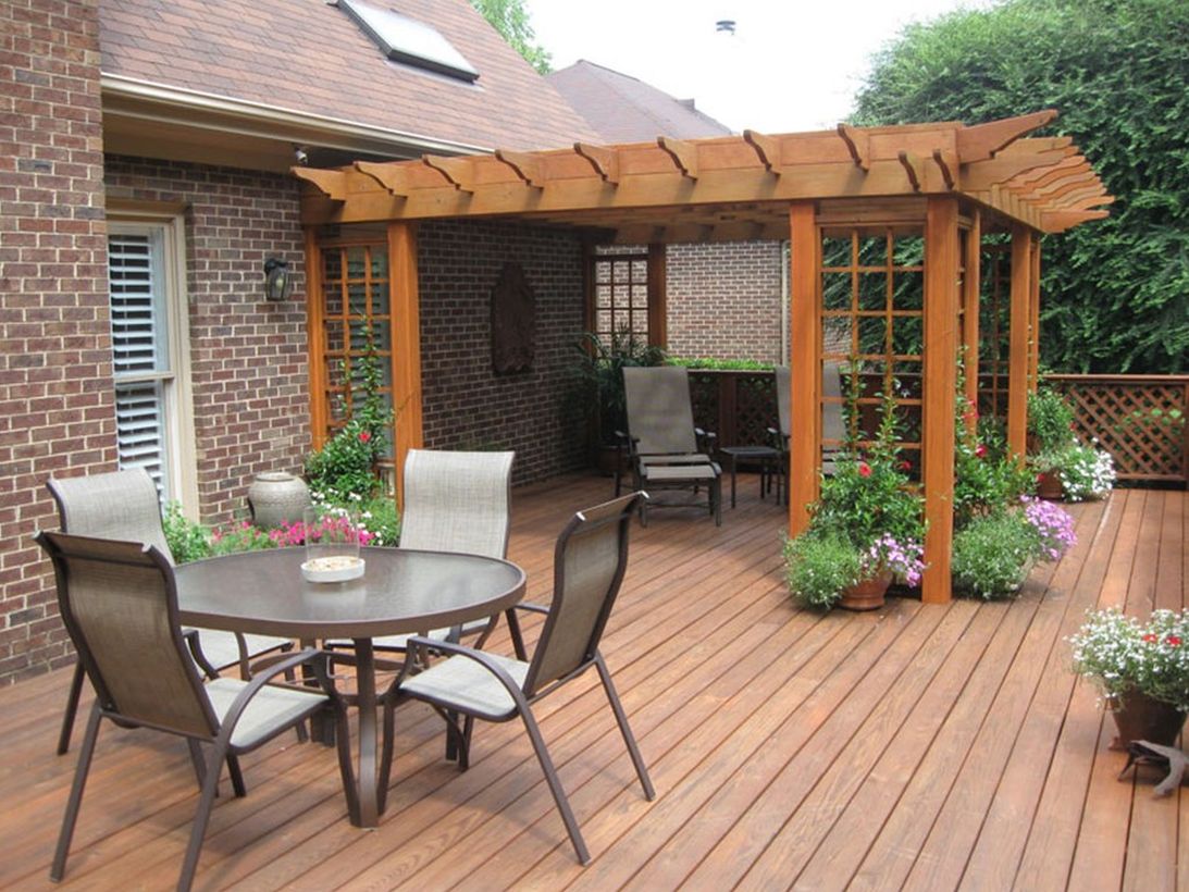 Backyard-patio-deck-design-with-greenery-to-decorate-your-patio-to-get-a-cool-atmosphere
