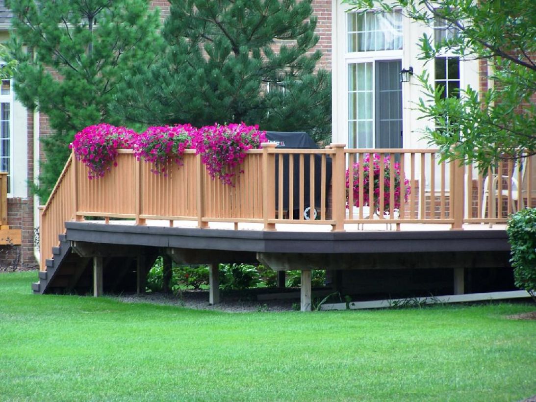 Backyard-patio-deck-design-with-purple-flowers-that-spread-on-your-patio-deck-beeper-adds-a-good-impression