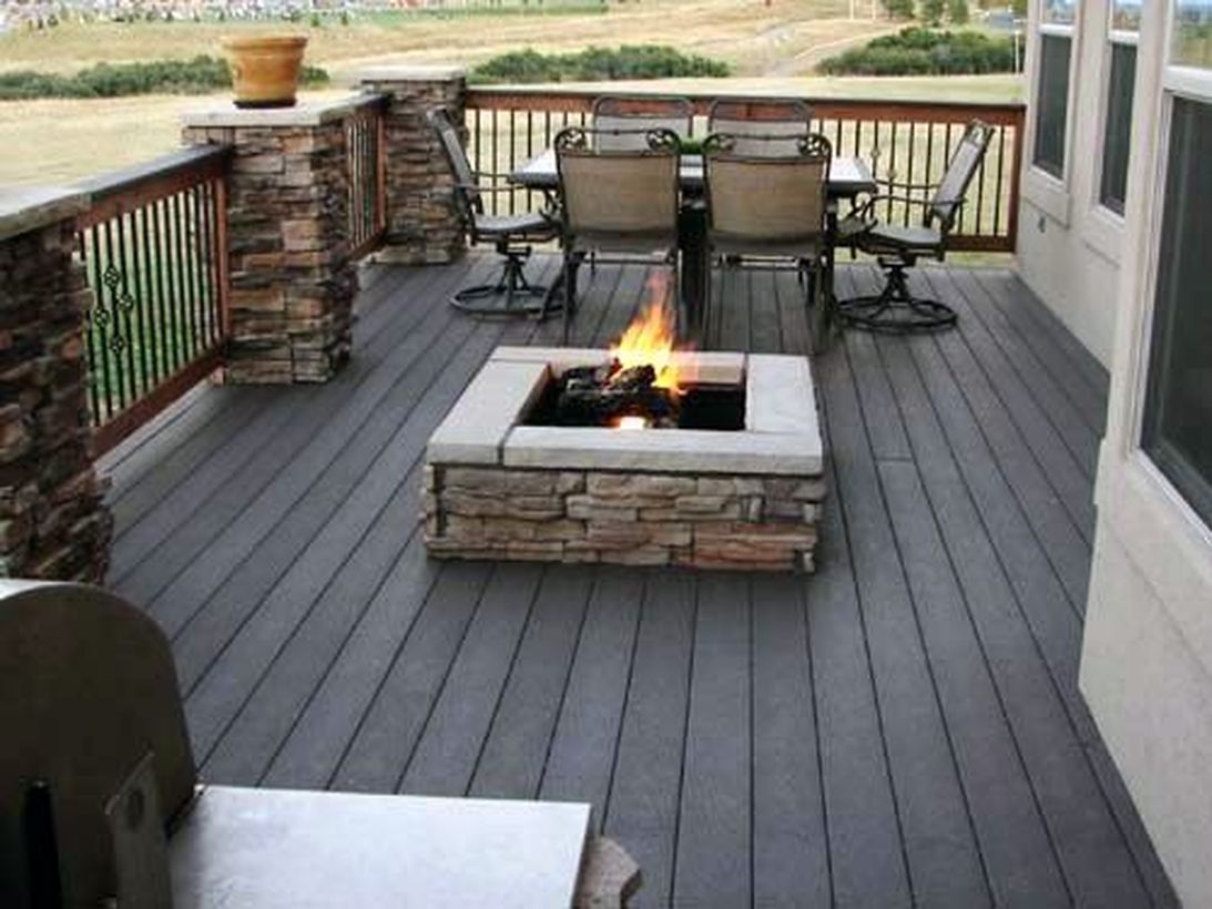 Backyard-patio-deck-with-fire-pit-to-warm-up-when-gathering-with-family
