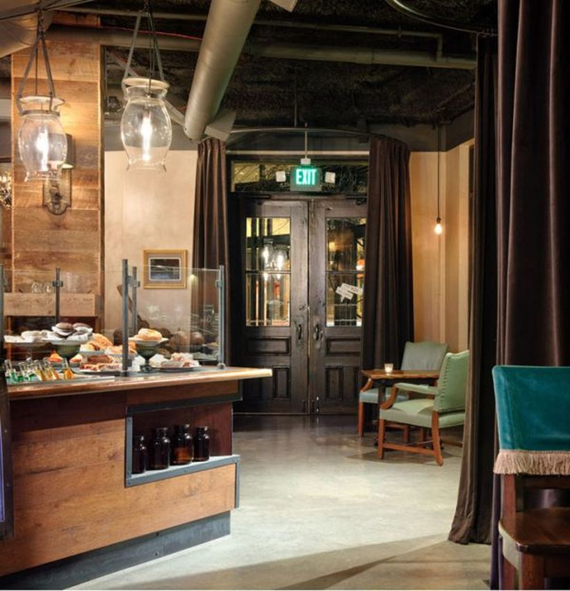 Coffee bar from brown wood combined with a chandelier that looks beautiful
