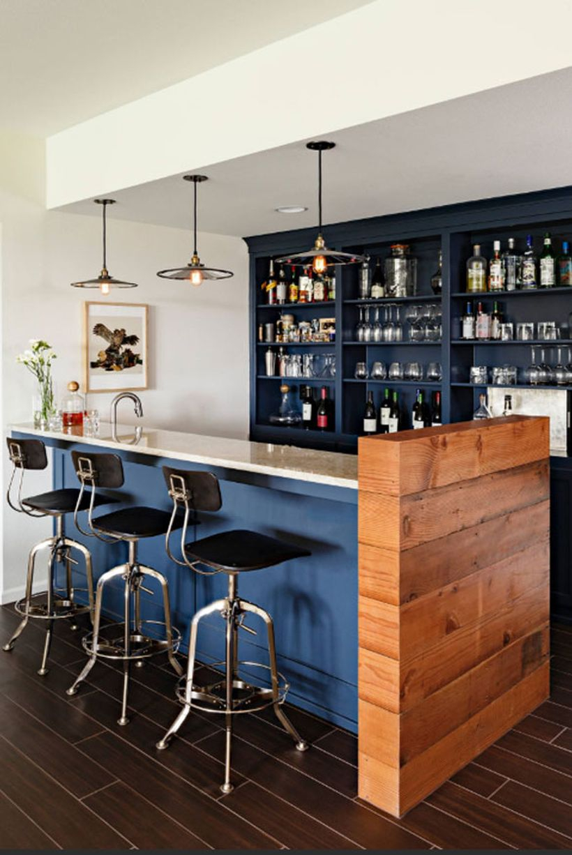 Dark blue coffee bar with blue table, small chairs and black chandelier to look amazing