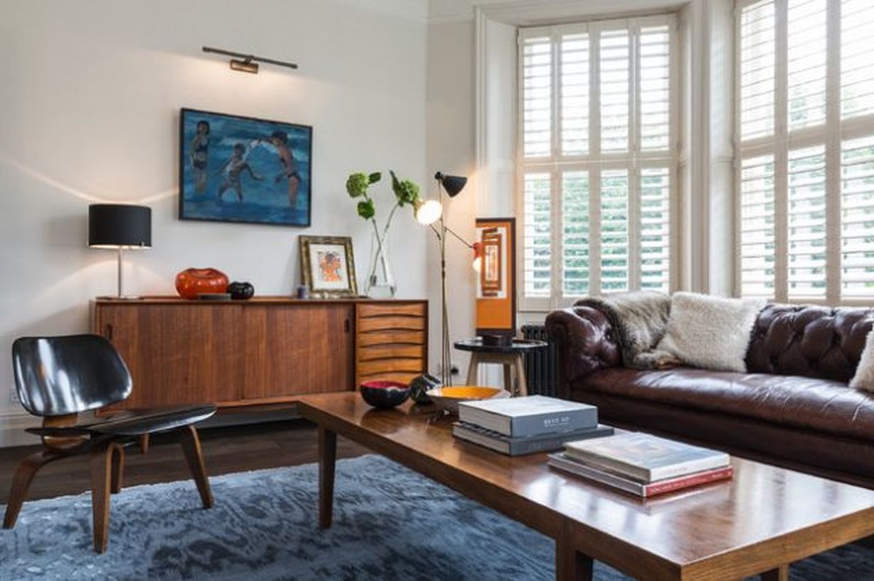 Decorating-a-retro-living-room-with-a-long-wooden-thick-coffee-table-and-a-unique-chair-that-is-comfortable-to-relax-in-the-living-room