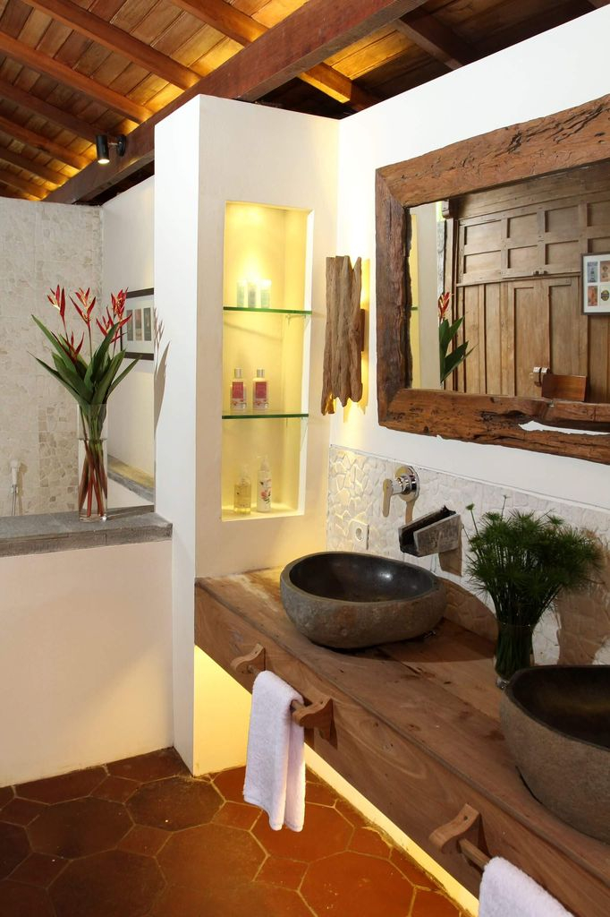 Farmhouse bathroom with wooden frame mirror