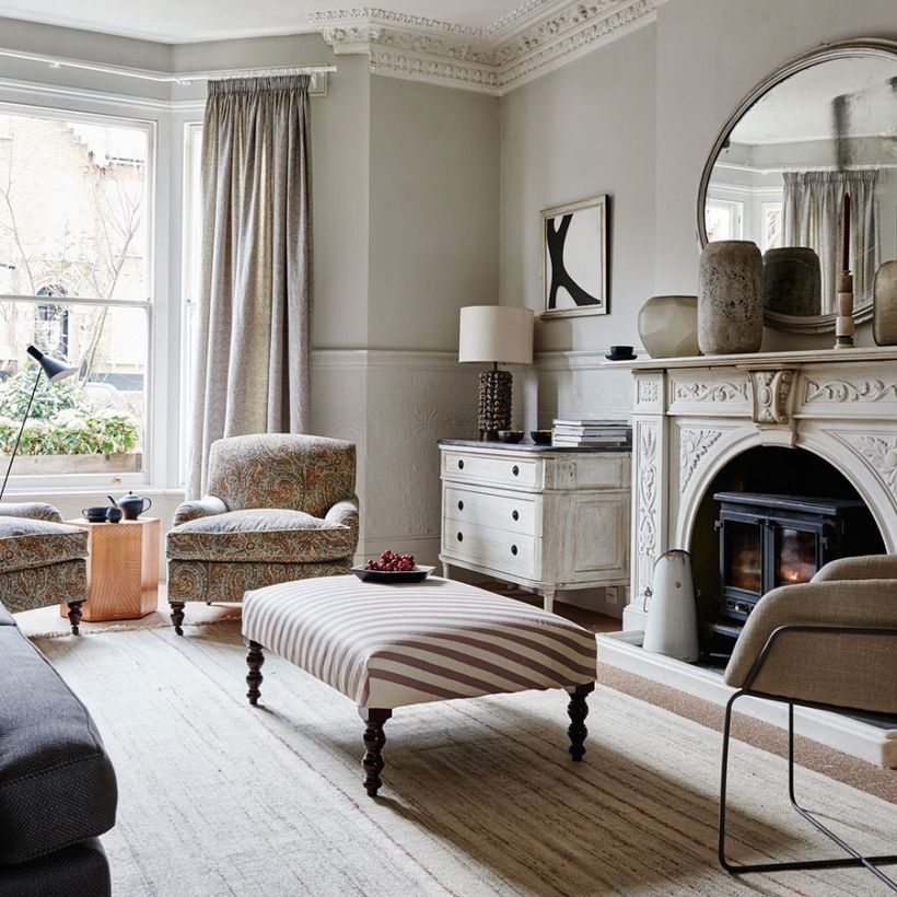 Neutral-color-scheme-living-room-with-paisley-print-sofa-and-rustic-cabinet-that-decorates-in-your-living-room